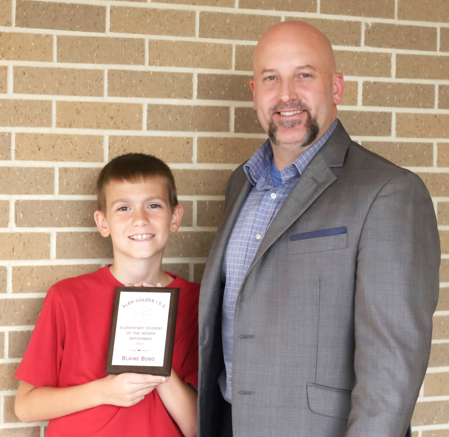 Alba-Golden fourth-grader Blaine Bobo, pictured with elementary school principal Kevin Wright, was selected as the elementary school student of the month.